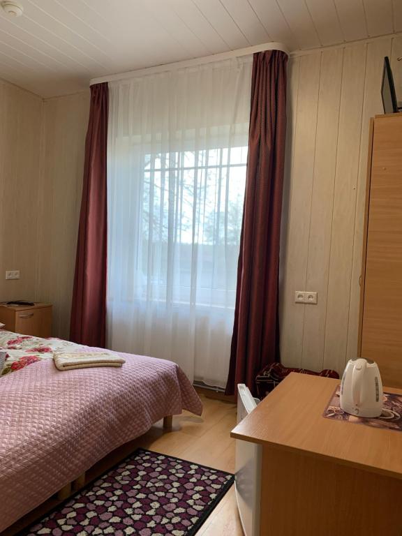 Postel nebo postele na pokoji v ubytování Rotušė