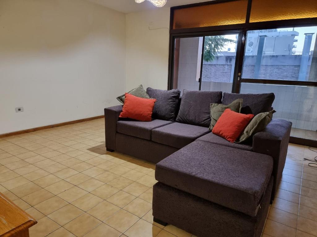 a living room with a couch and a chair at Departamento Mendoza in Mendoza