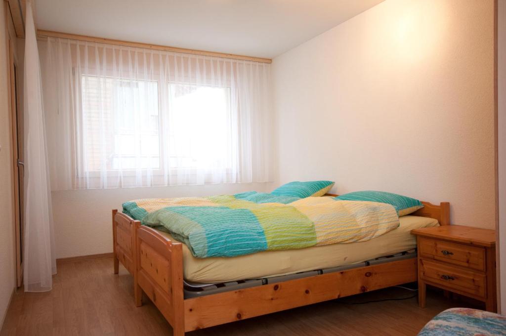 Postel nebo postele na pokoji v ubytování Alpbachstrasse 4, Meiringen