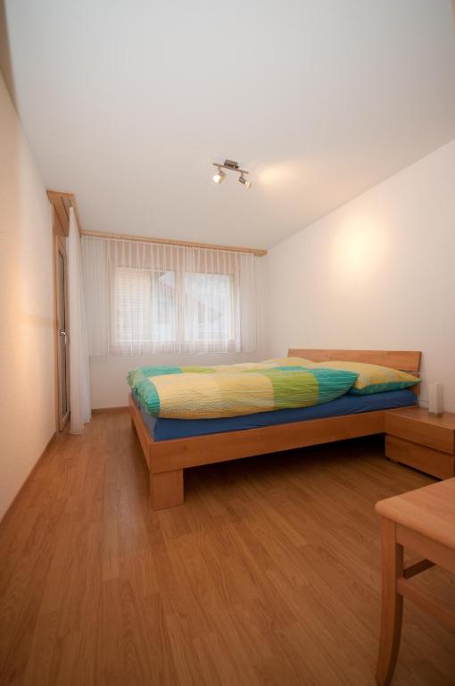 Postel nebo postele na pokoji v ubytování Alpbachstrasse 4, Meiringen