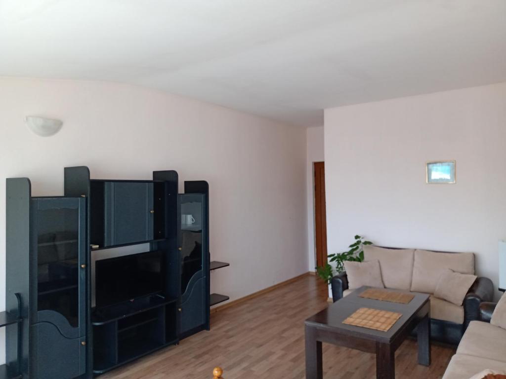 a living room with a couch and a table at Guest House Diamant in Sozopol