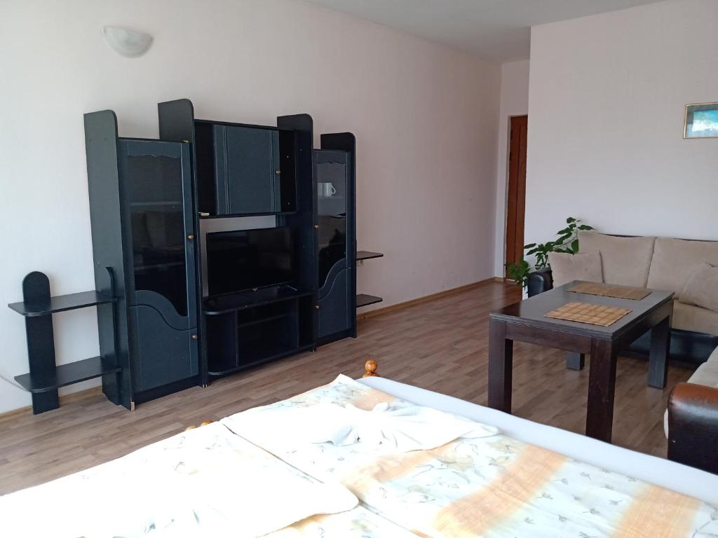 a living room with black furniture and a couch at Guest House Diamant in Sozopol
