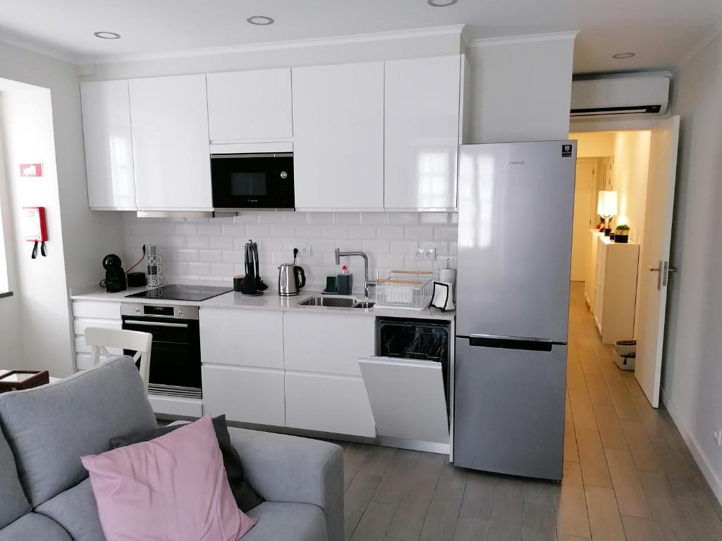 Kuchyň nebo kuchyňský kout v ubytování Miragaia Star Apartments