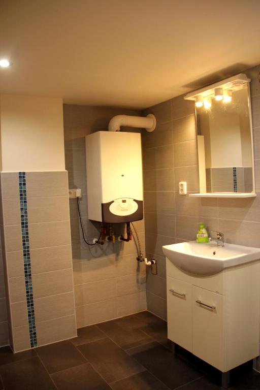 a bathroom with a sink and a mirror at Chalupa Nové Losiny in Nové Losiny