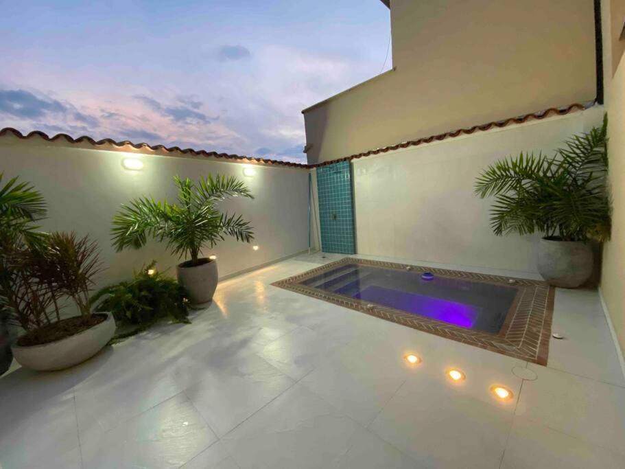 a patio with a jacuzzi tub on a building at MARAYA CAMPESTRE in Pereira