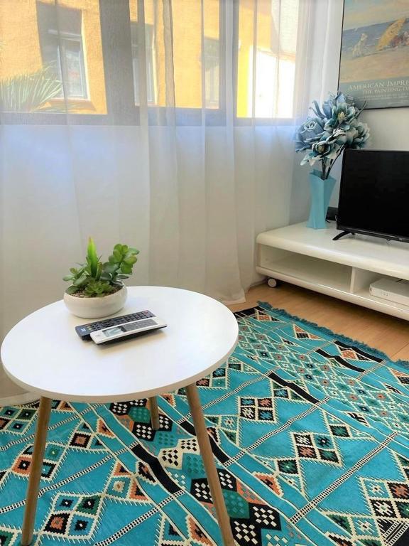 TV a/nebo společenská místnost v ubytování Oasis City Center