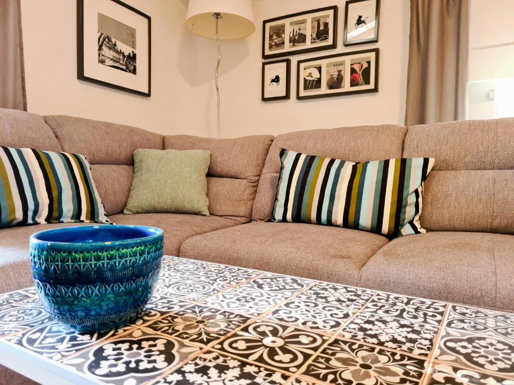 a living room with a couch and a table at Navigare Apartment in Opatija