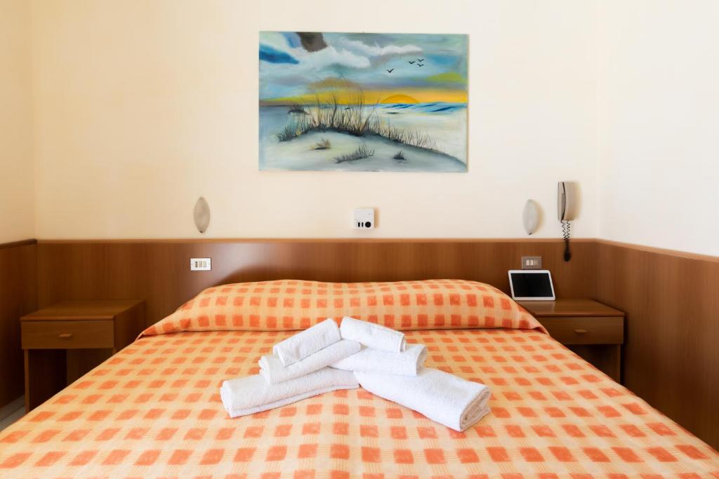 Postel nebo postele na pokoji v ubytování Albergo Rosa & Cosetta