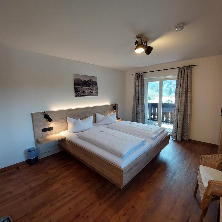 Postel nebo postele na pokoji v ubytování Hotel Garni Malerwinkl
