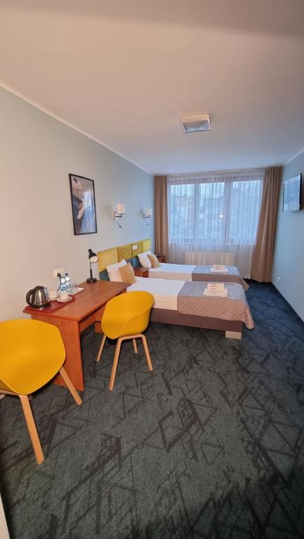 Posteľ alebo postele v izbe v ubytovaní Carina Hotel