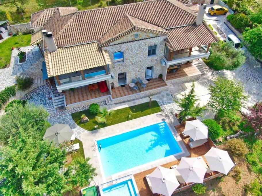an aerial view of a house with a swimming pool at Petra House in Áno Korakiána