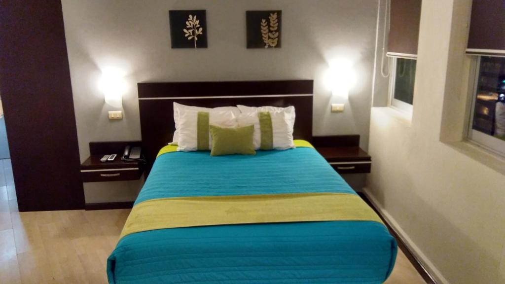 Postel nebo postele na pokoji v ubytování Hotel Misión Express Xalapa