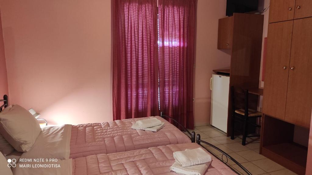 Postel nebo postele na pokoji v ubytování Porto Sabatiki