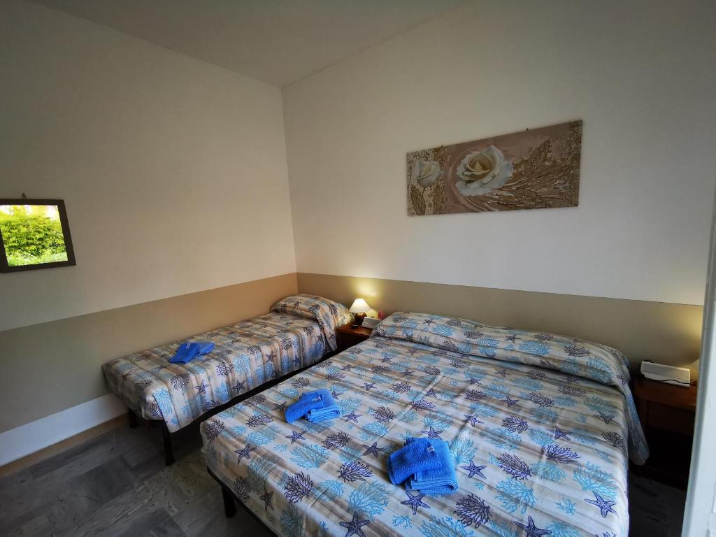 Posteľ alebo postele v izbe v ubytovaní Casa Serena