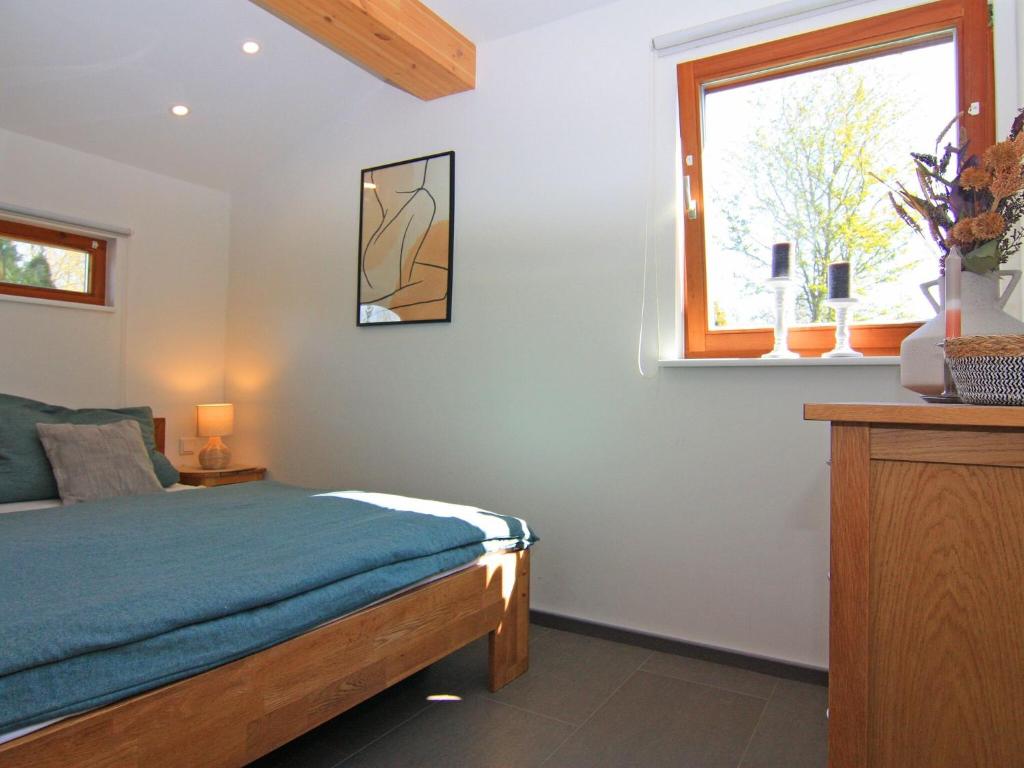 Postel nebo postele na pokoji v ubytování Blockhaus in Damp