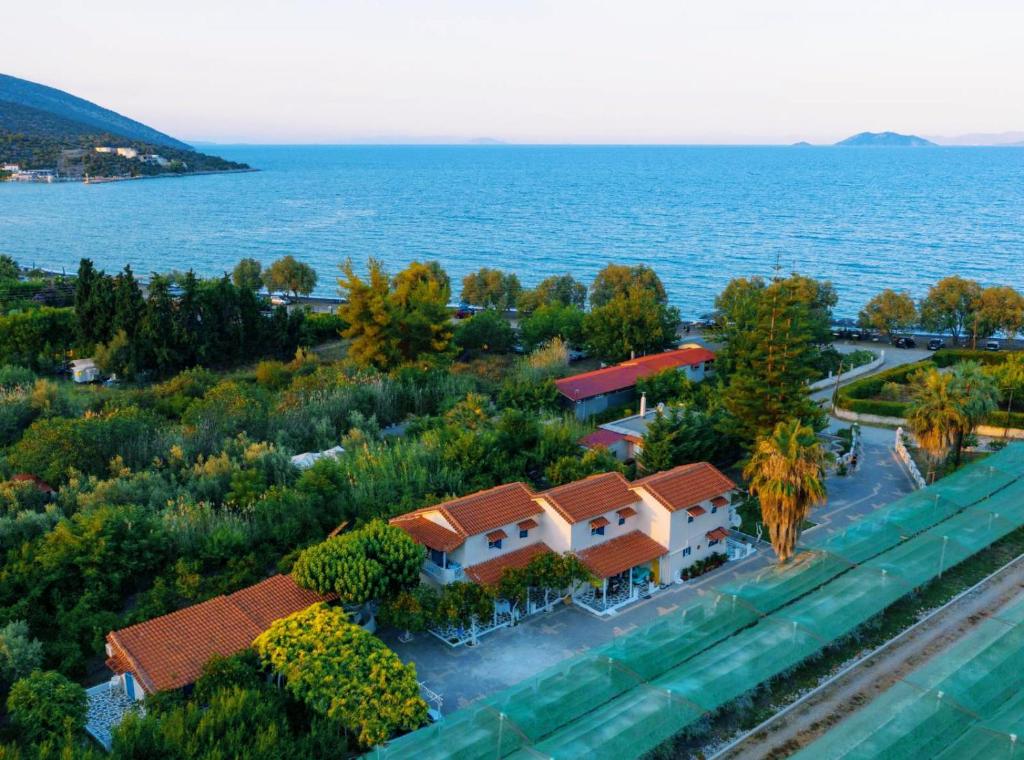 an aerial view of a house by the water at Sea waves apartments in Nea Epidavros