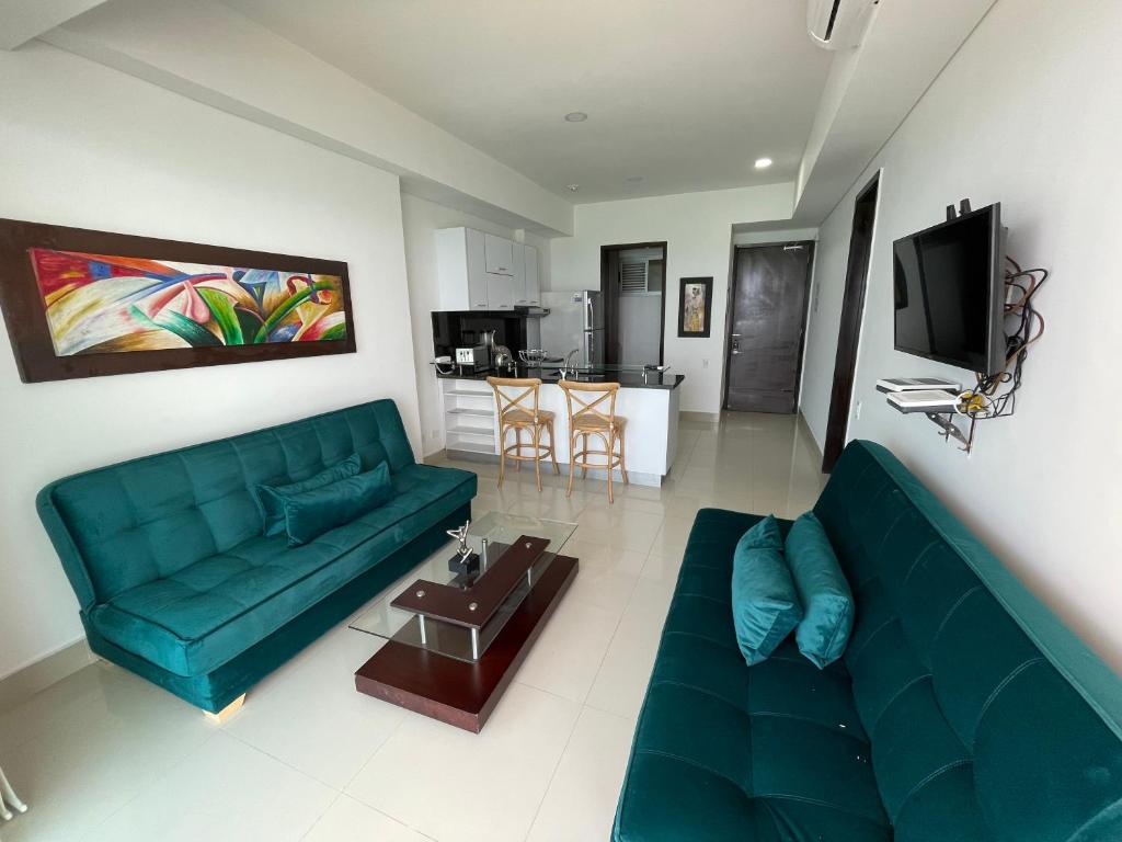 TV a/nebo společenská místnost v ubytování Playa Cartagena Apartments