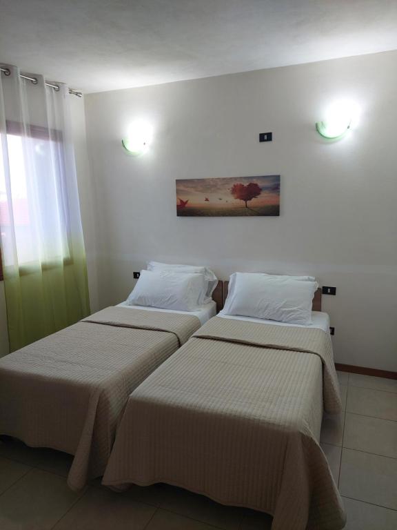 Postel nebo postele na pokoji v ubytování B&B Marku