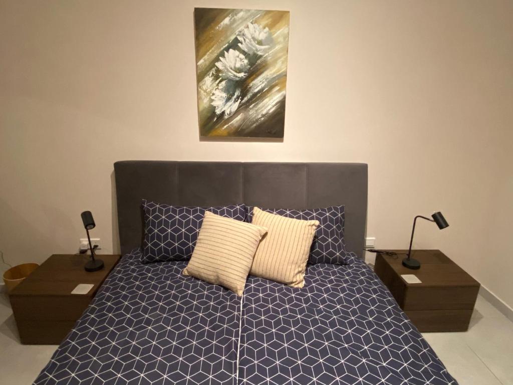 Postel nebo postele na pokoji v ubytování Maltese Garden Villa