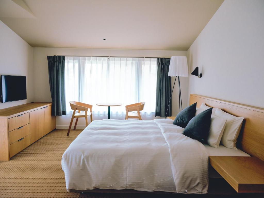 Postel nebo postele na pokoji v ubytování BIRD HOTEL