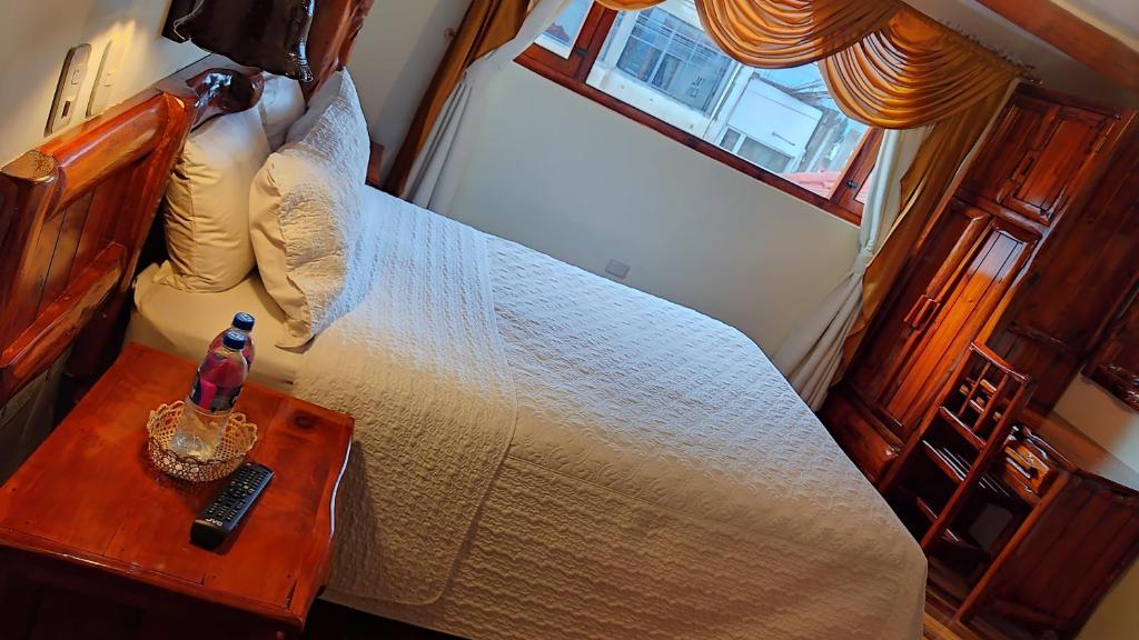 Postel nebo postele na pokoji v ubytování Hotel Maderanegra By Huasicama