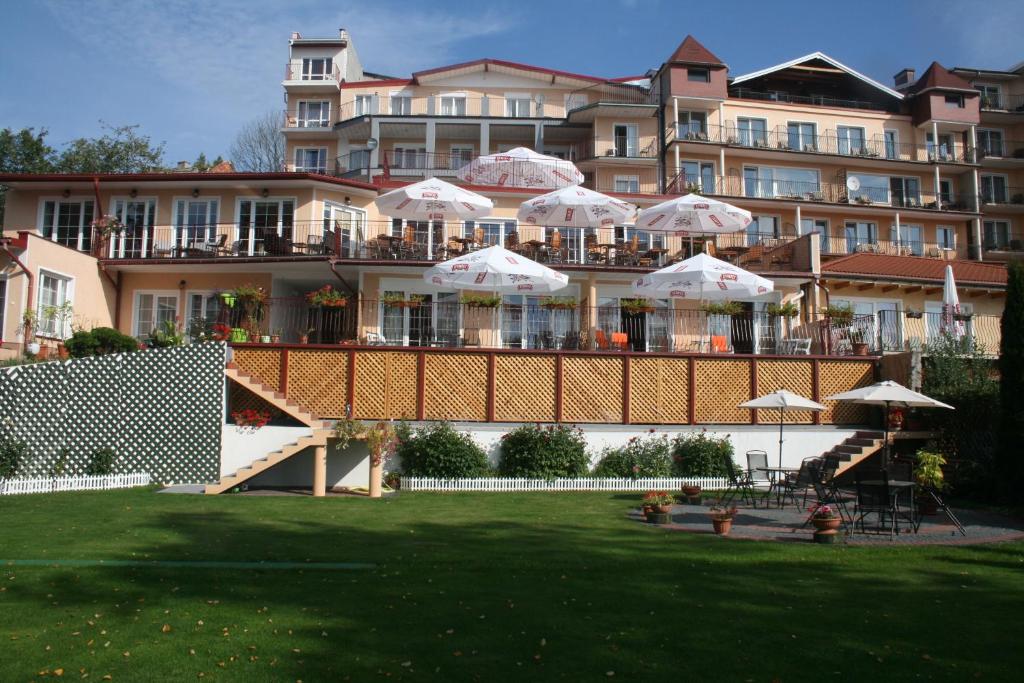 a large building with umbrellas on top of it at Eva in Mrągowo