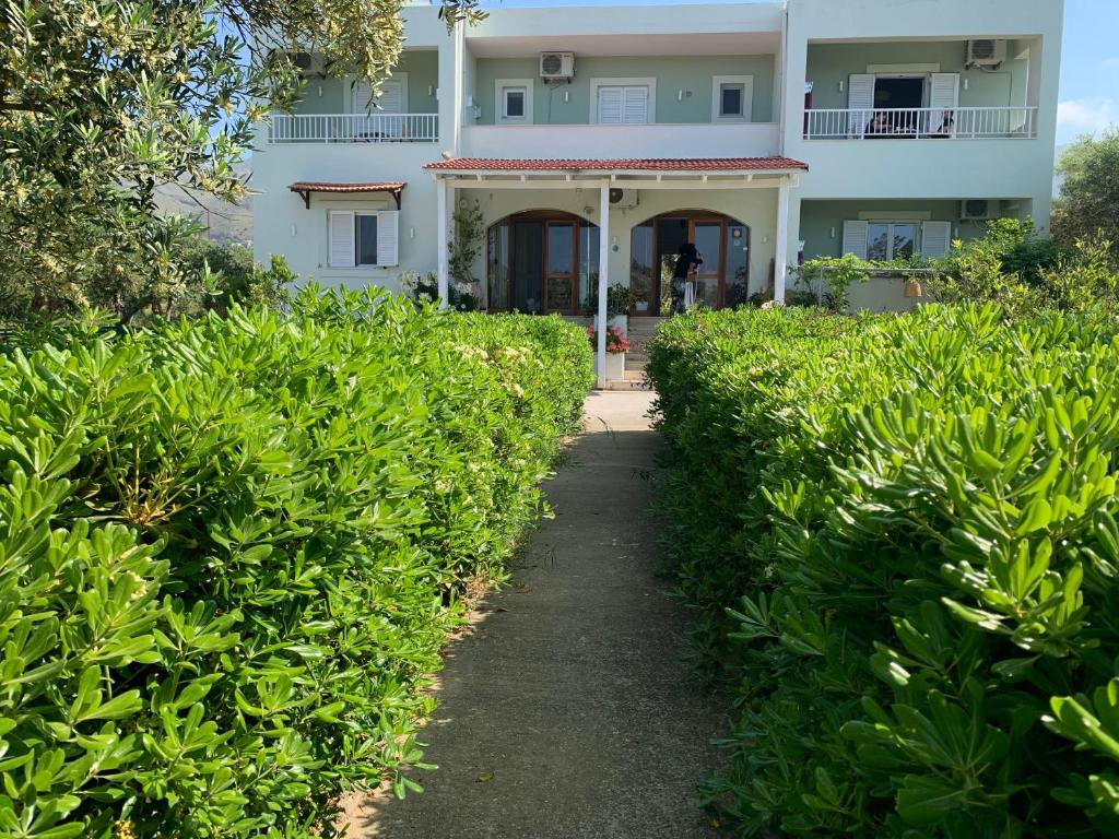 a house with a path leading to it at Kassiani Studios in Plakias