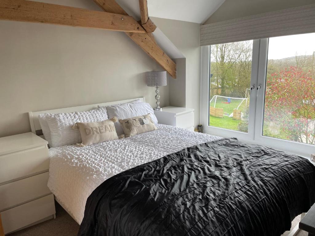Postel nebo postele na pokoji v ubytování The Barn at Well Cottage