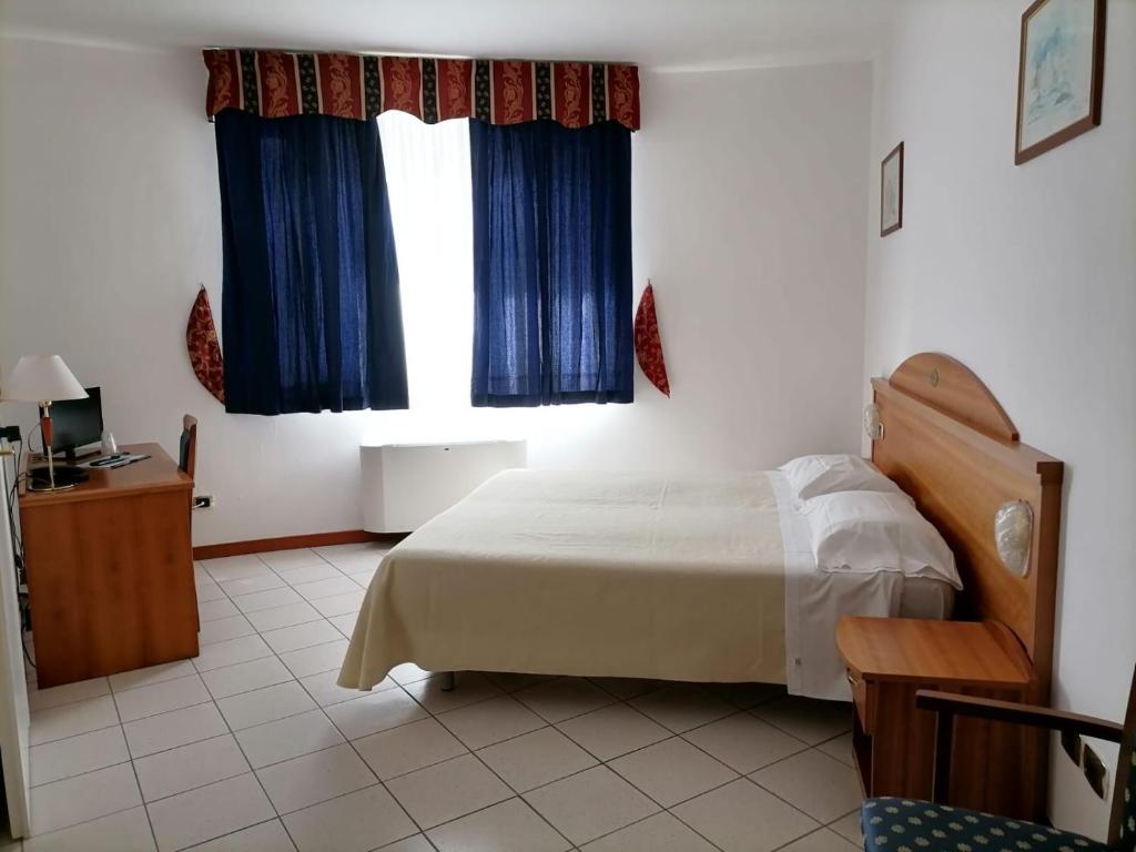Postel nebo postele na pokoji v ubytování Partenone Resort Hotel