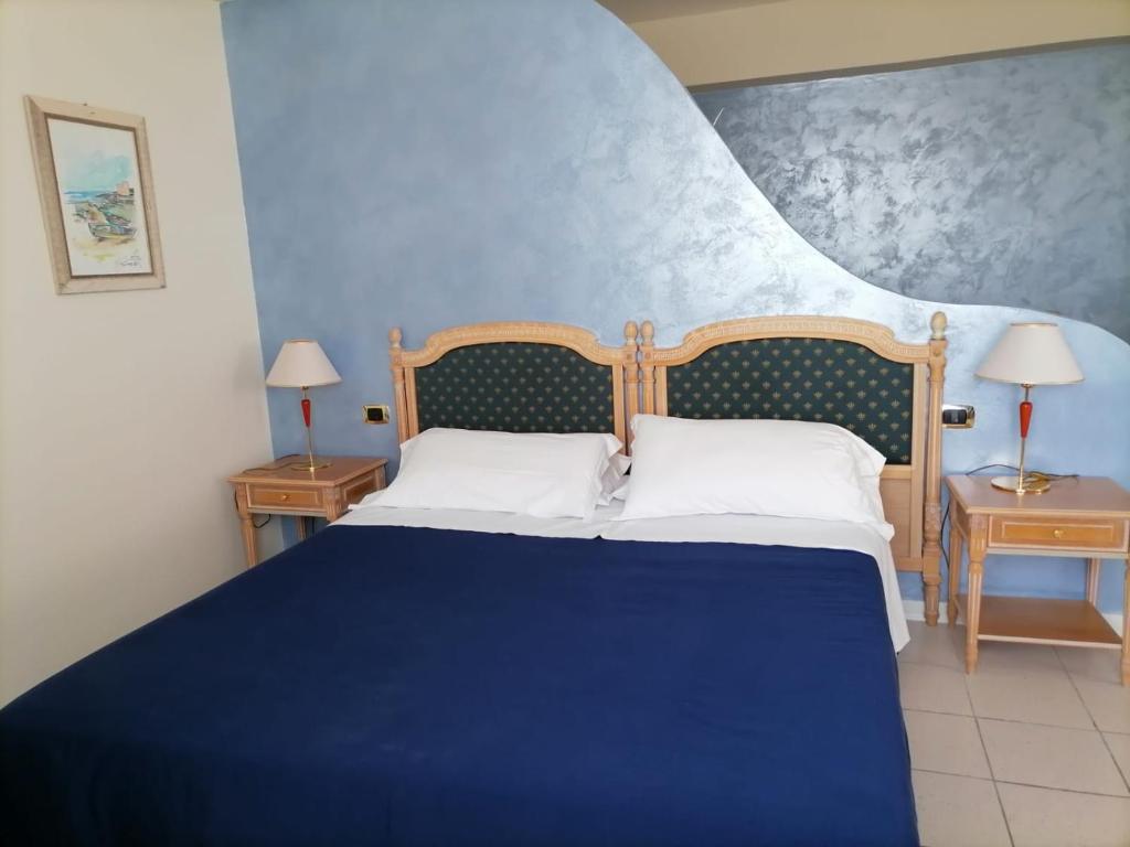 Postel nebo postele na pokoji v ubytování Partenone Resort Hotel
