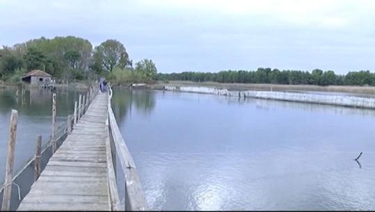 a wooden bridge over a large body of water at Hotel MARIO, Shengjin in Shëngjin