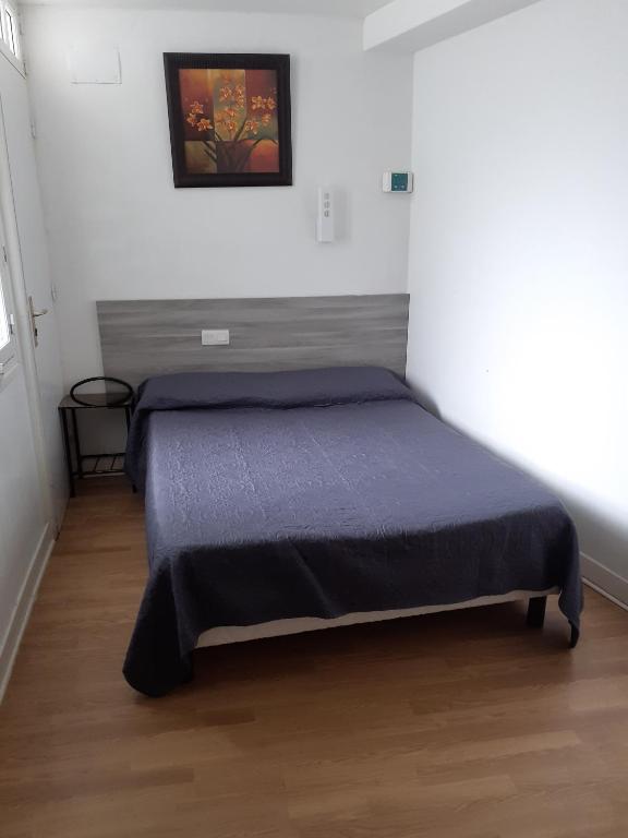 Postel nebo postele na pokoji v ubytování Hôtel Croix des Nordistes