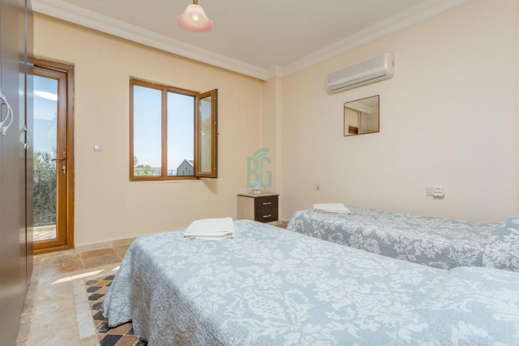 Postel nebo postele na pokoji v ubytování BG Villas & Aparts