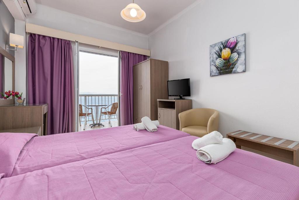 Postel nebo postele na pokoji v ubytování Oasis Hotel