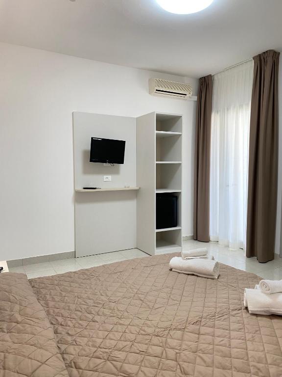 TV a/nebo společenská místnost v ubytování Hotel Bahia