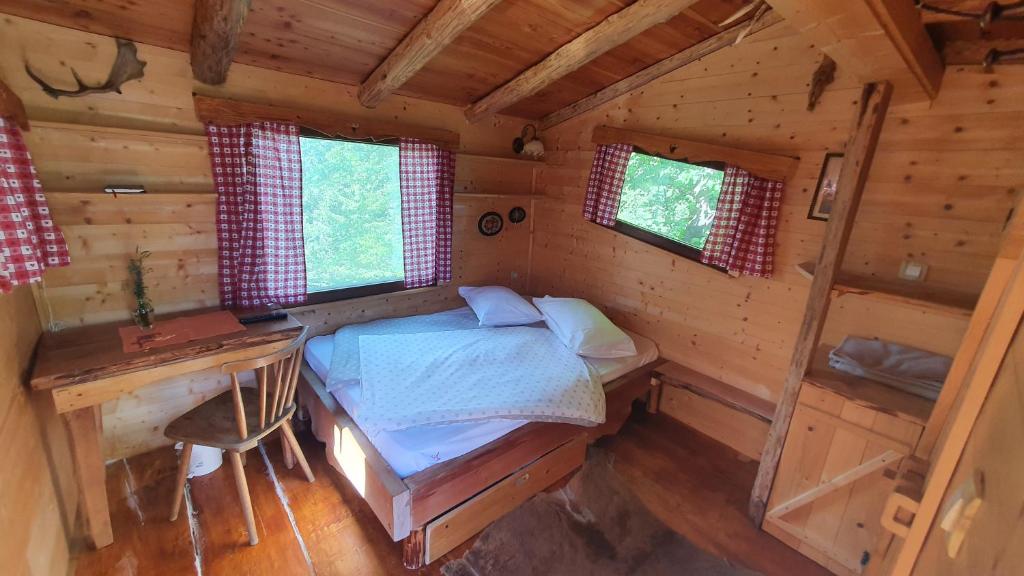 an overhead view of a bedroom in a log cabin at Treehouse Toplak in Ruše