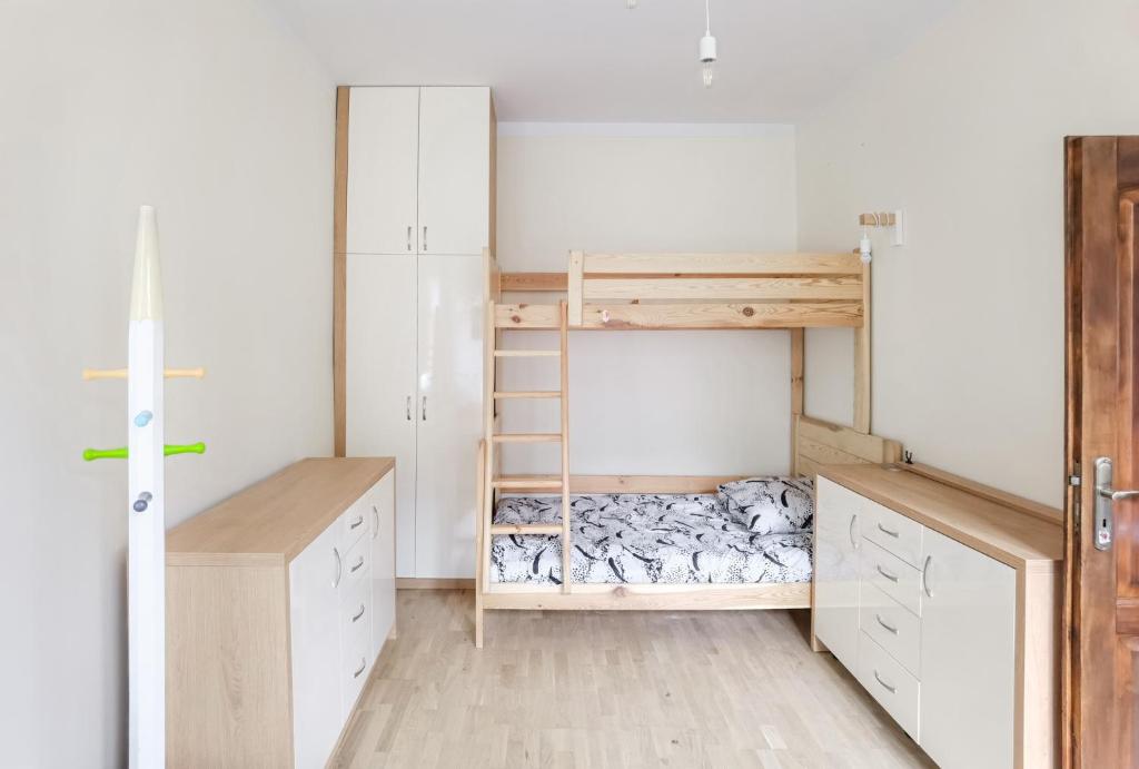 Posteľ alebo postele v izbe v ubytovaní Apartament Mazurek