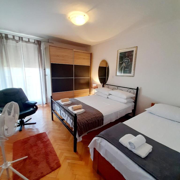 Posteľ alebo postele v izbe v ubytovaní Apartment Doverska Split