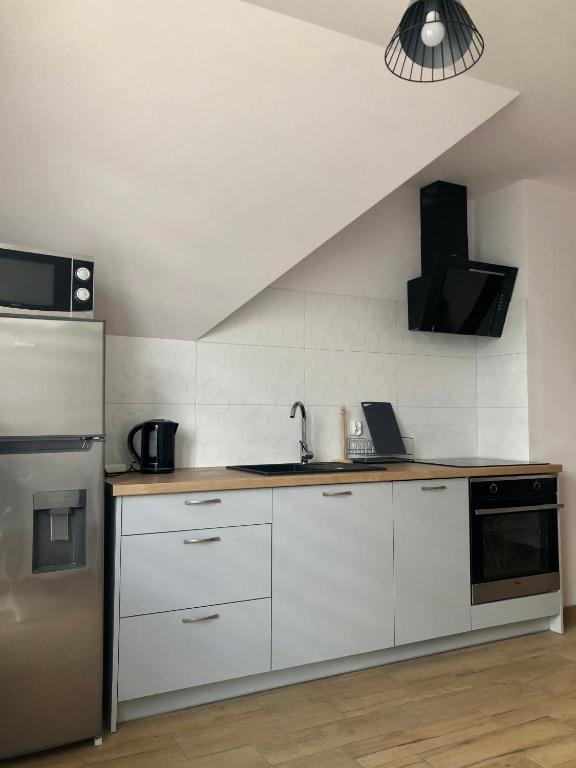 Kuchyňa alebo kuchynka v ubytovaní Apartament Rybical - POKOJE