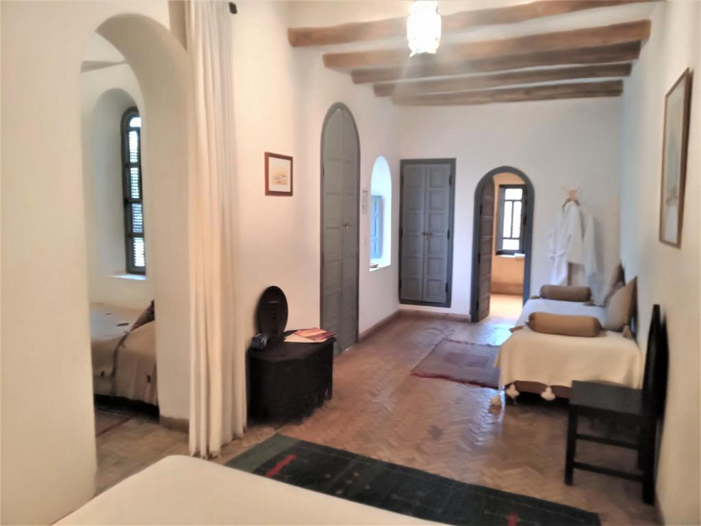 Postel nebo postele na pokoji v ubytování Riad Sahara Nour