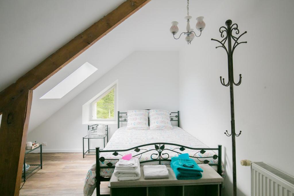 a bedroom with a bed in a attic at Les rayonnantes in La Roche-Maurice