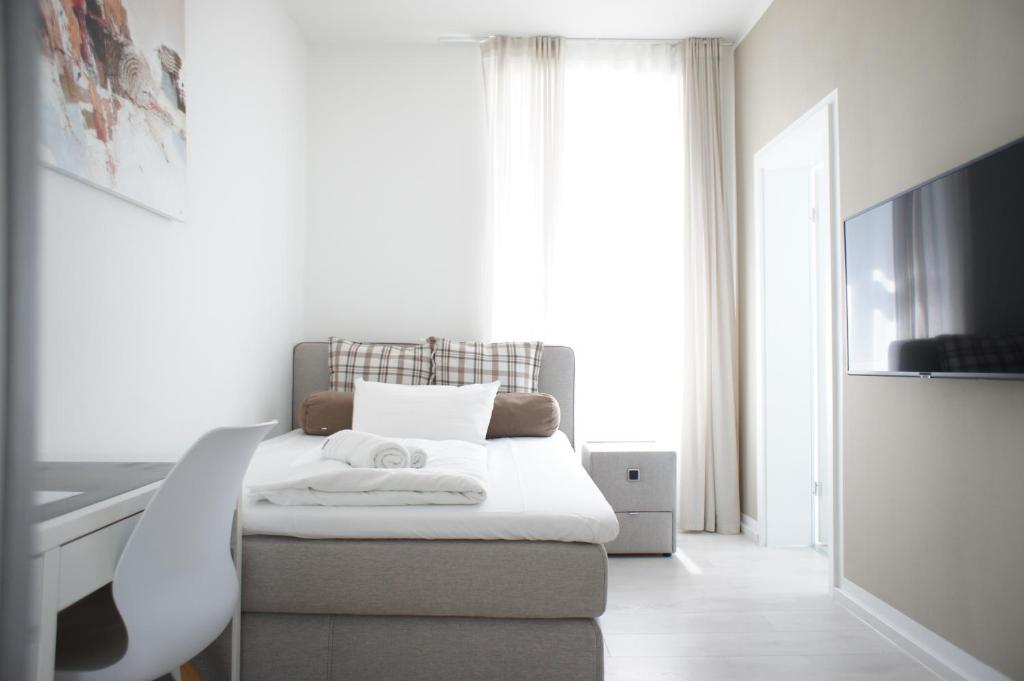 Postel nebo postele na pokoji v ubytování Hotel Böke Rheinfelden