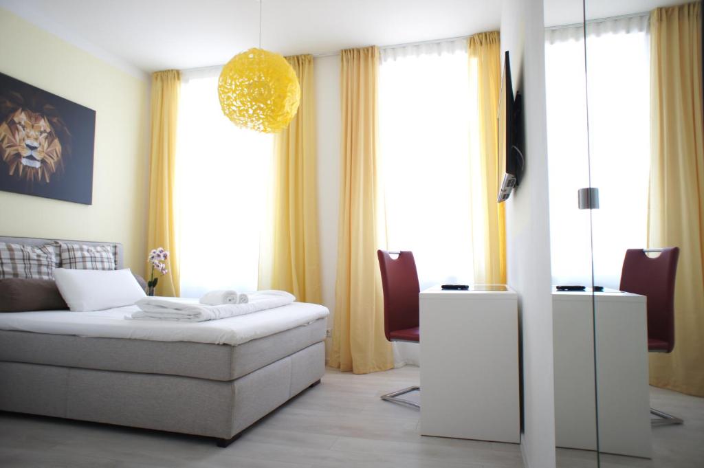 Postel nebo postele na pokoji v ubytování Hotel Böke Rheinfelden