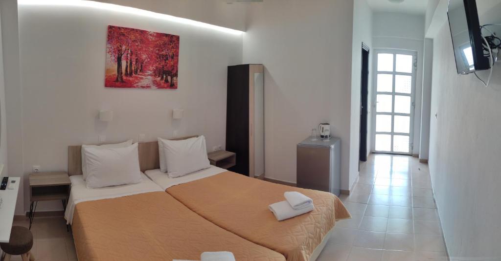 Postel nebo postele na pokoji v ubytování Afroditi Hotel