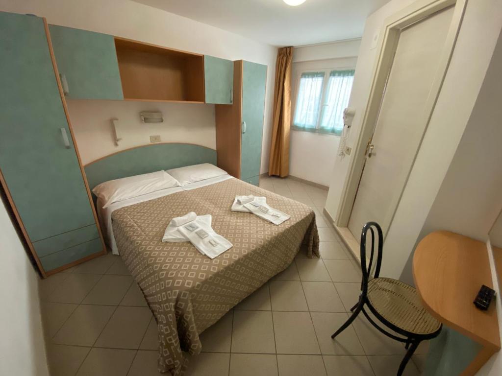 Posteľ alebo postele v izbe v ubytovaní Hotel Nanni Garnì