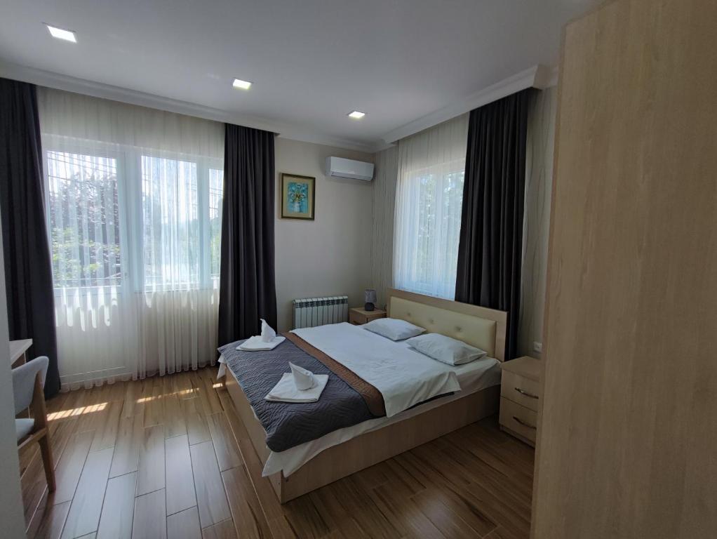Postel nebo postele na pokoji v ubytování Hotel Botanica
