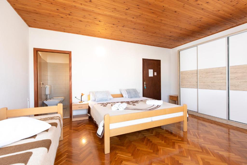 Postel nebo postele na pokoji v ubytování Bed and Breakfast Ema
