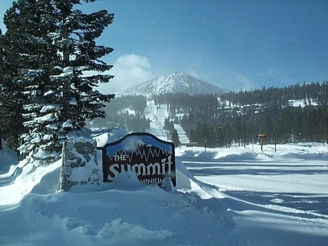 a sign in the snow in front of a mountain at Summit Ski Resort 2BR-2BA, Mammoth Lakes in Mammoth Lakes