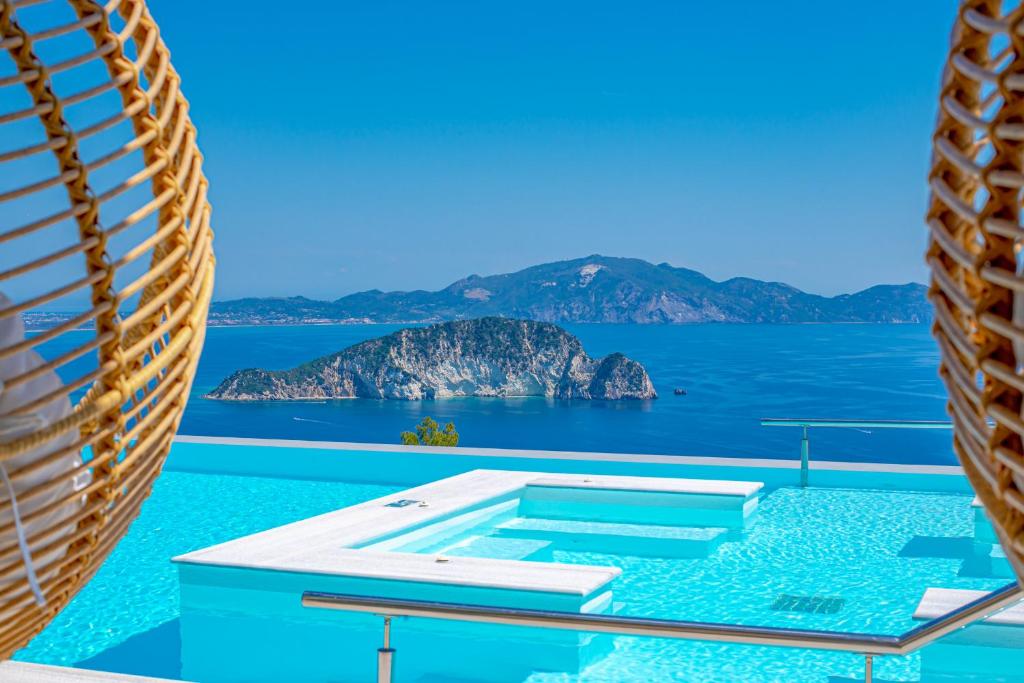 a view of the ocean from a pool on a cruise ship at Villa Lamar Private Luxury Villa in Marathias