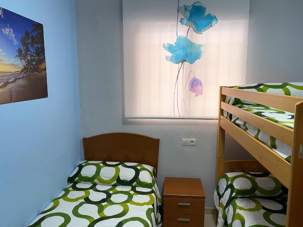 Postel nebo postele na pokoji v ubytování Costa Marina III en primera línea de playa con fibra